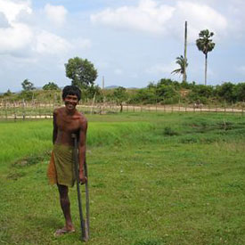 [Photo: Landmine-Disabled Father]